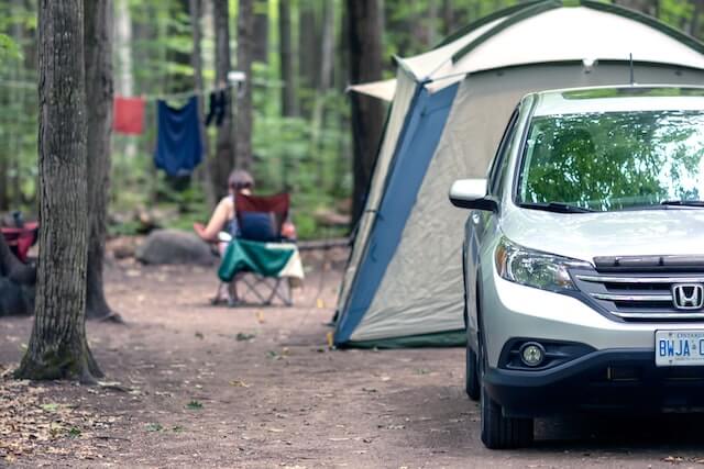 Car with tent on a
campsite