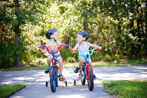 Two girls cycling
together