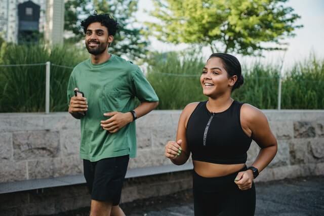 Two people running together