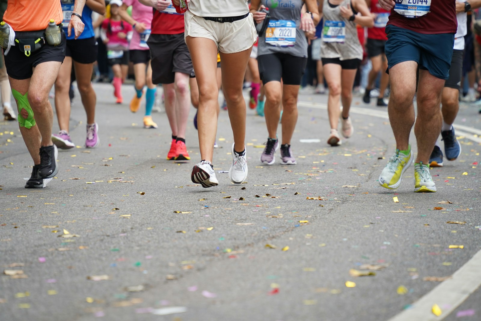 A group of runners training together on a flat path