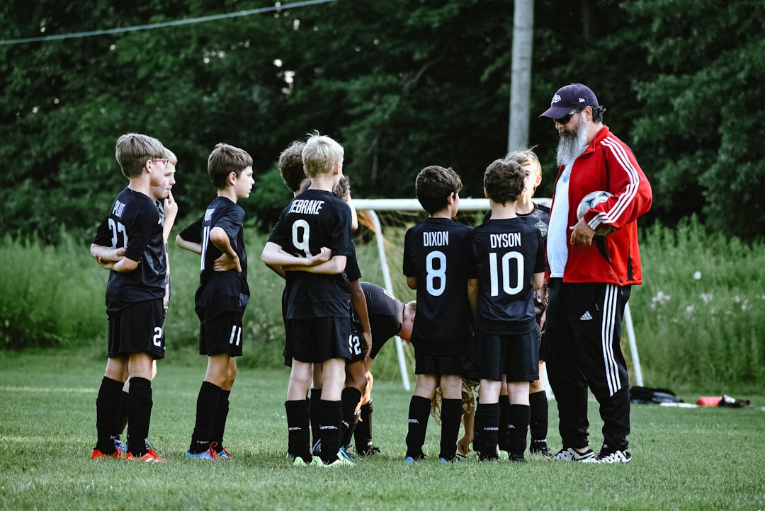 Children standing together in junior team sport uniforms before a game