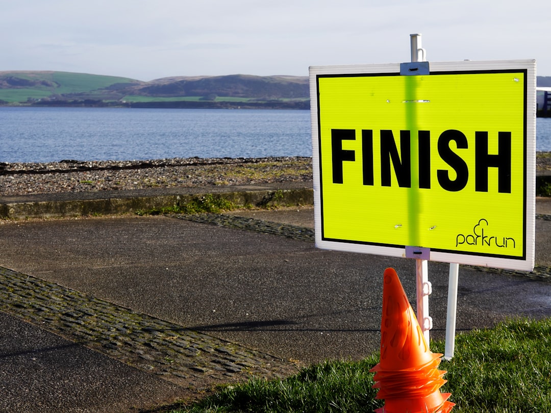 A finish line sign at a parkrun event in an Australian park on a Saturday morning