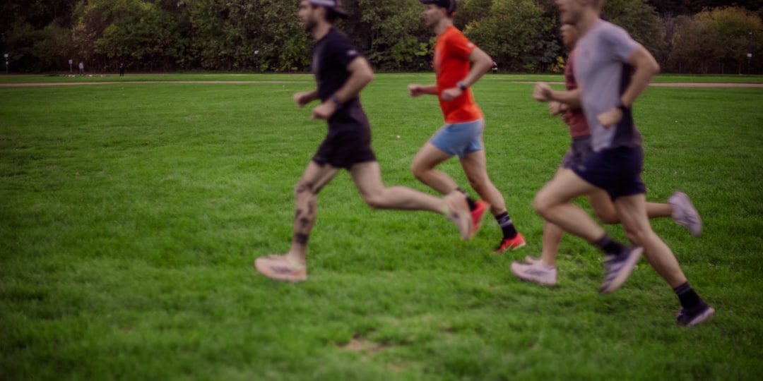 Group of walkers and runners gathering before a community parkrun event in Australia