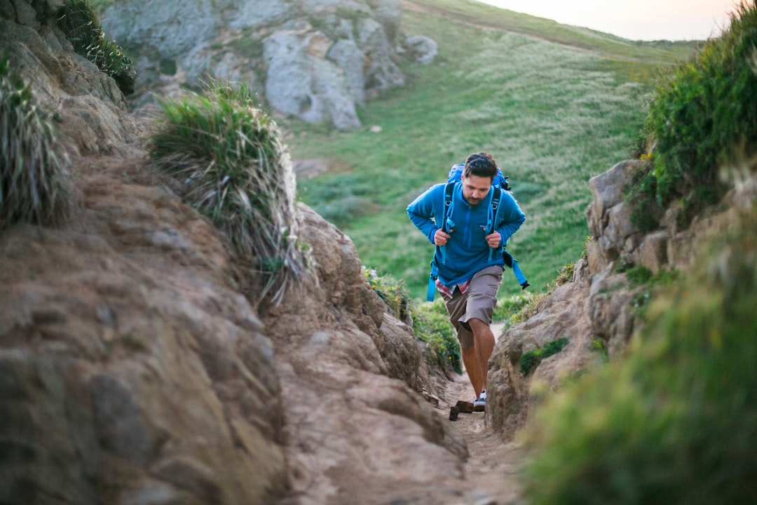 Runner climbing a hill during training
