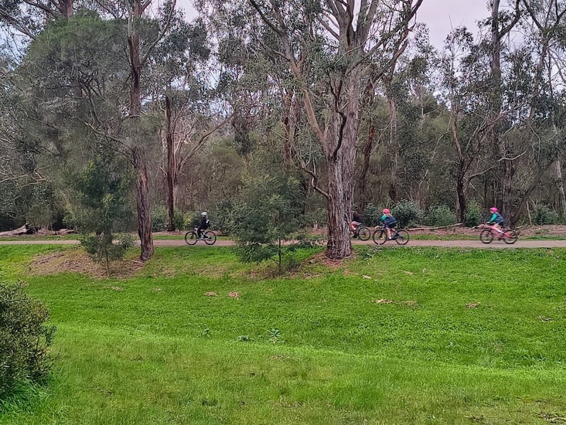 Children cycling on the wide sealed Tarralla Creek shared path
