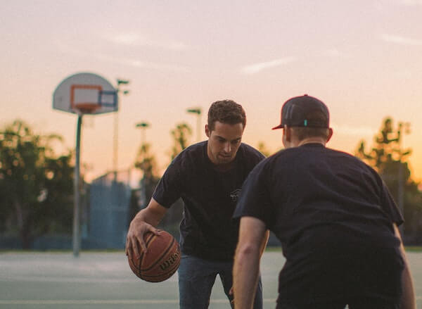 Basketball coach running a training drill
