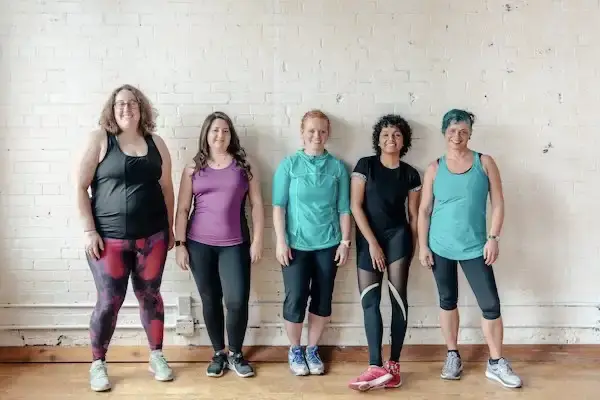 Body positive image of ladies standing next to each other