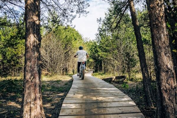 A man riding an e-bike on a cycling track
