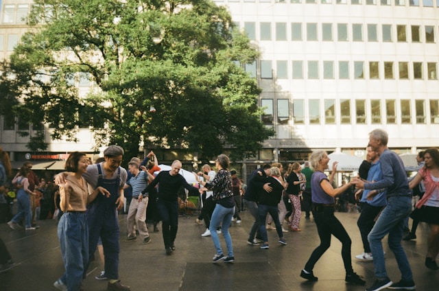 people dancing on a street