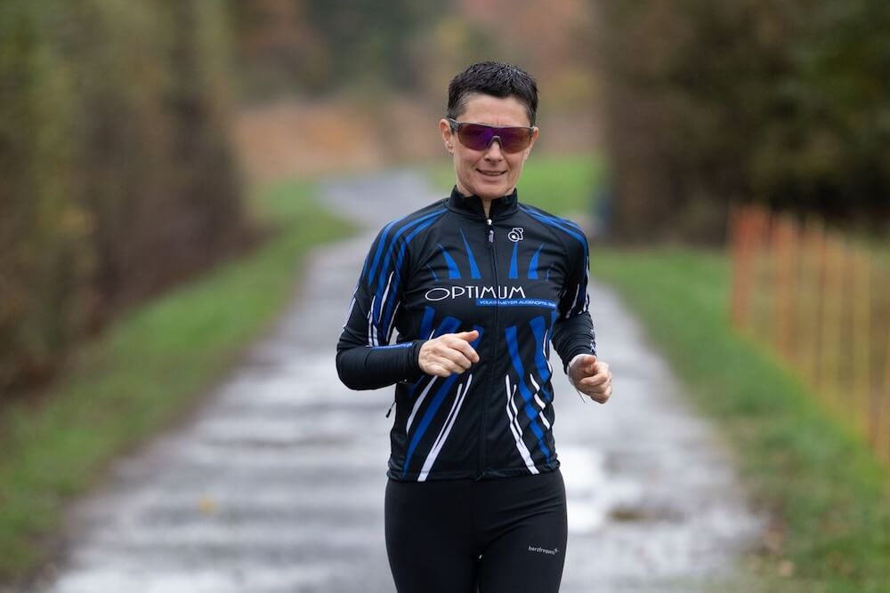 A runner following a familiar path after rain
