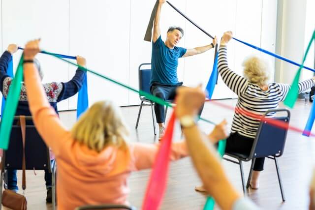 Older adults following a seated resistance band class